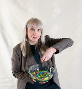 Diane Knoll, OTR/L playing with a bowl of water beads as an example of tactile play. Tactile play and exploration is an important component of a sensory diet. 